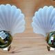 Pair of Deknudt shell wall lights