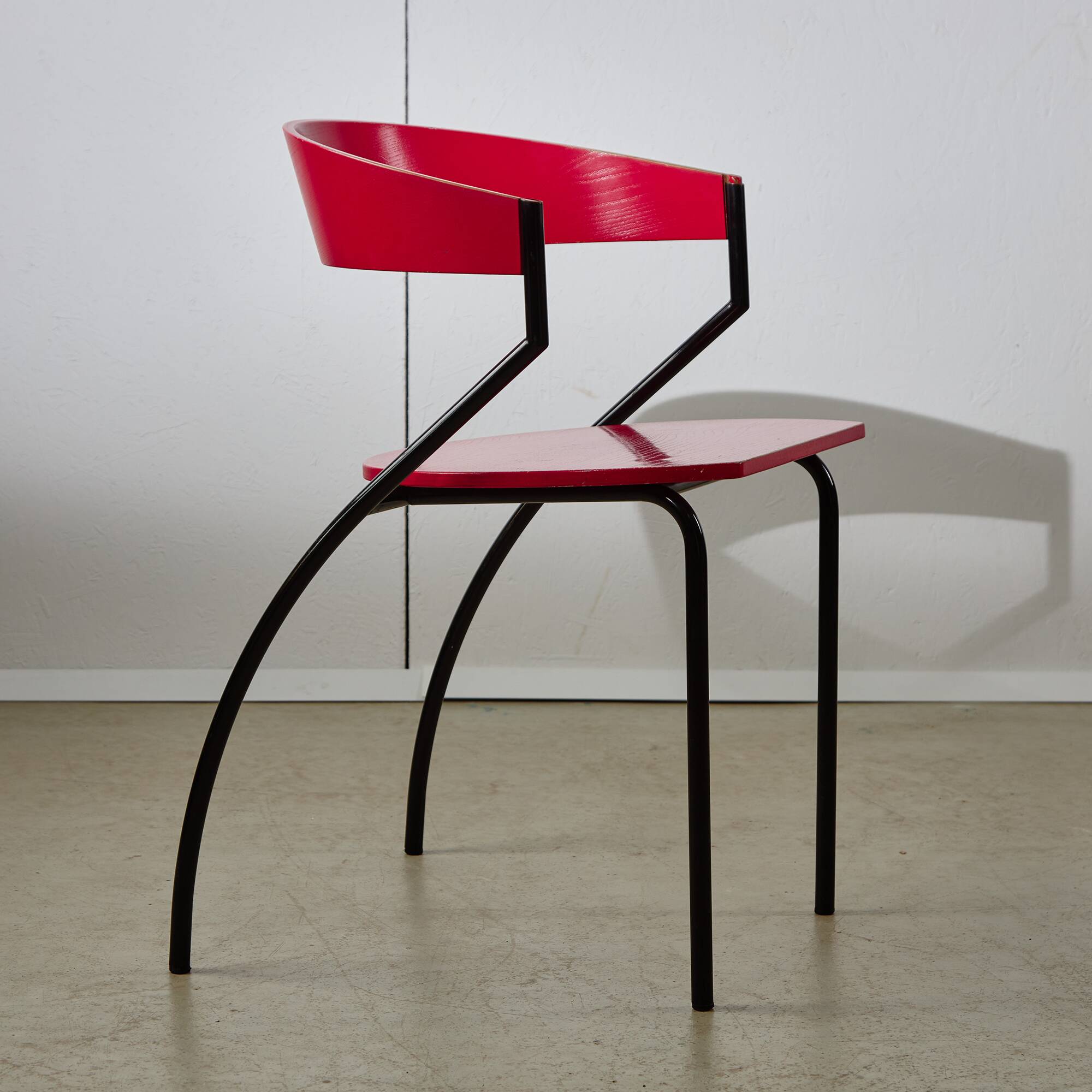 Red Plywood and Curved Metal Frame Chair