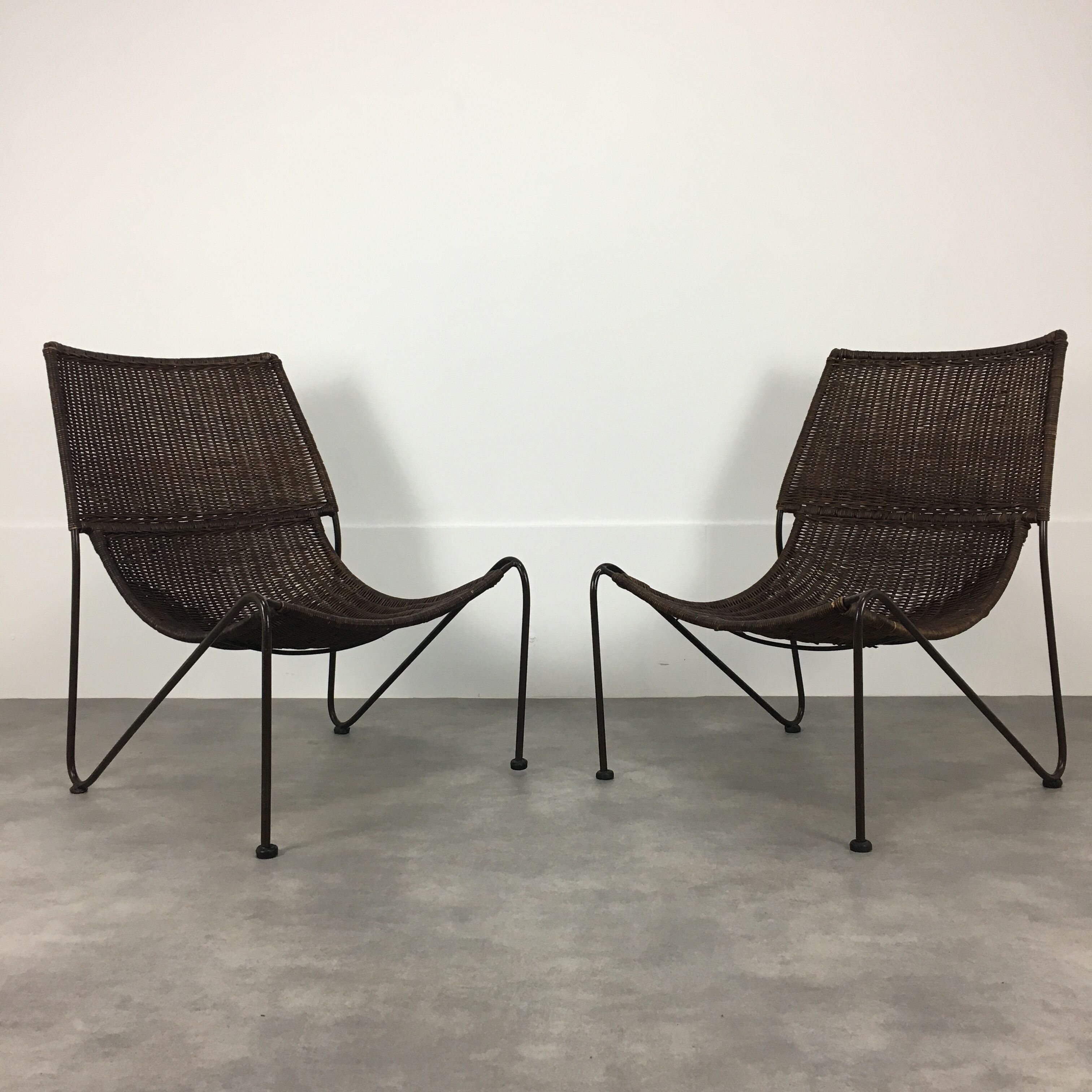 Pair of rattan and steel wire armchairs by frederick weinberg