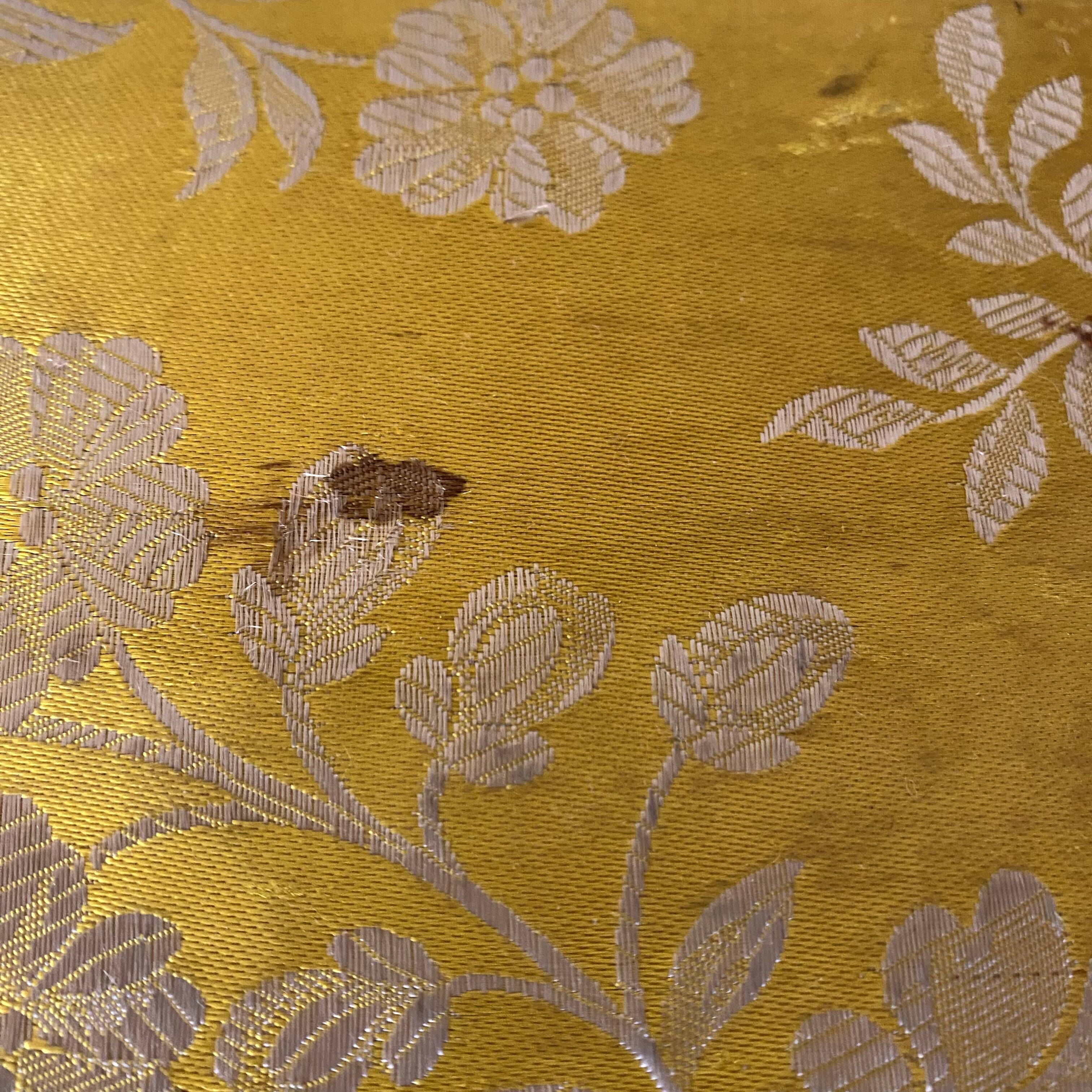 Low stool with antique wood and fabric footrest