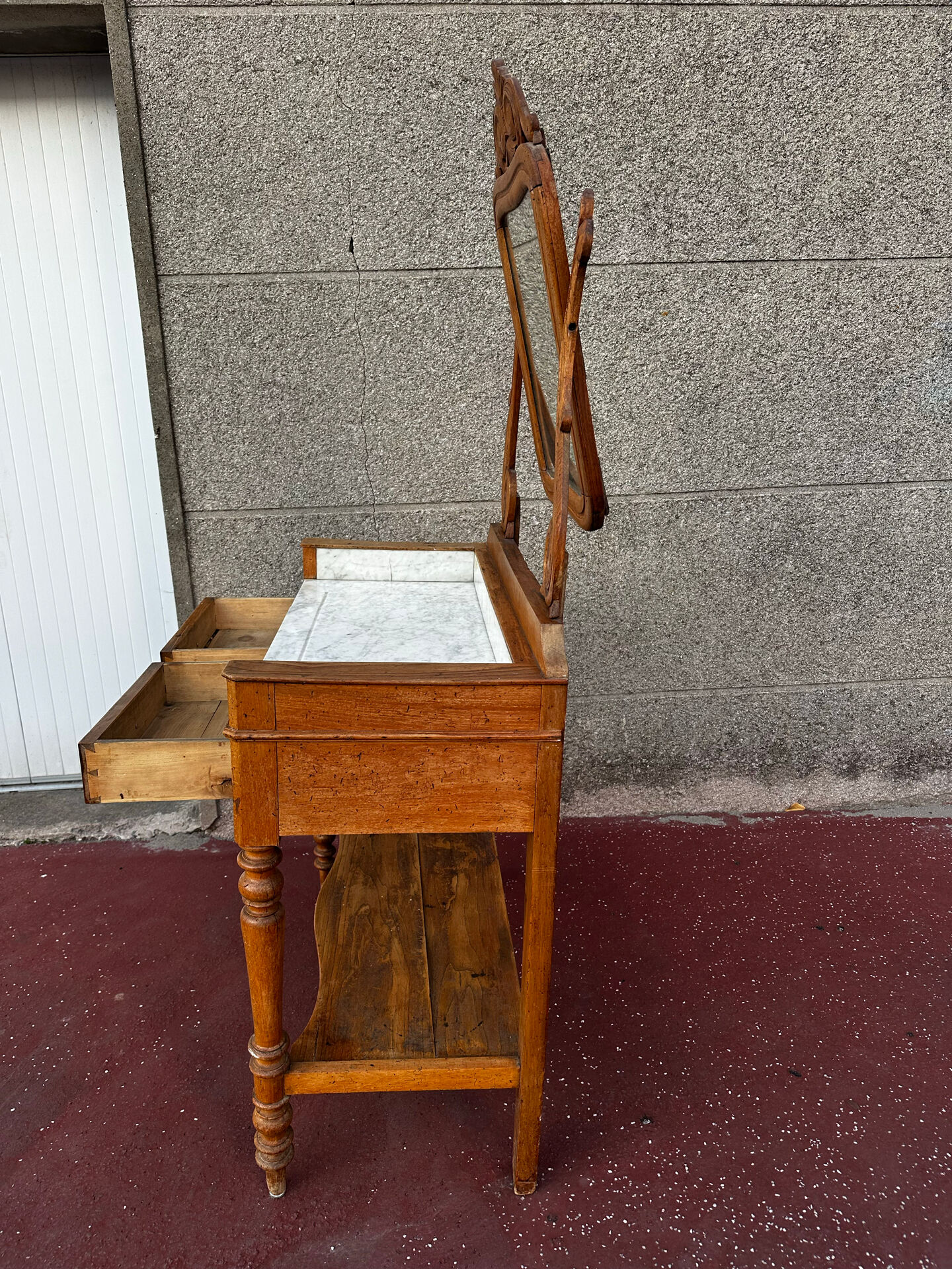 Walnut and marble dressing table, mercury mirror, circa 1850.