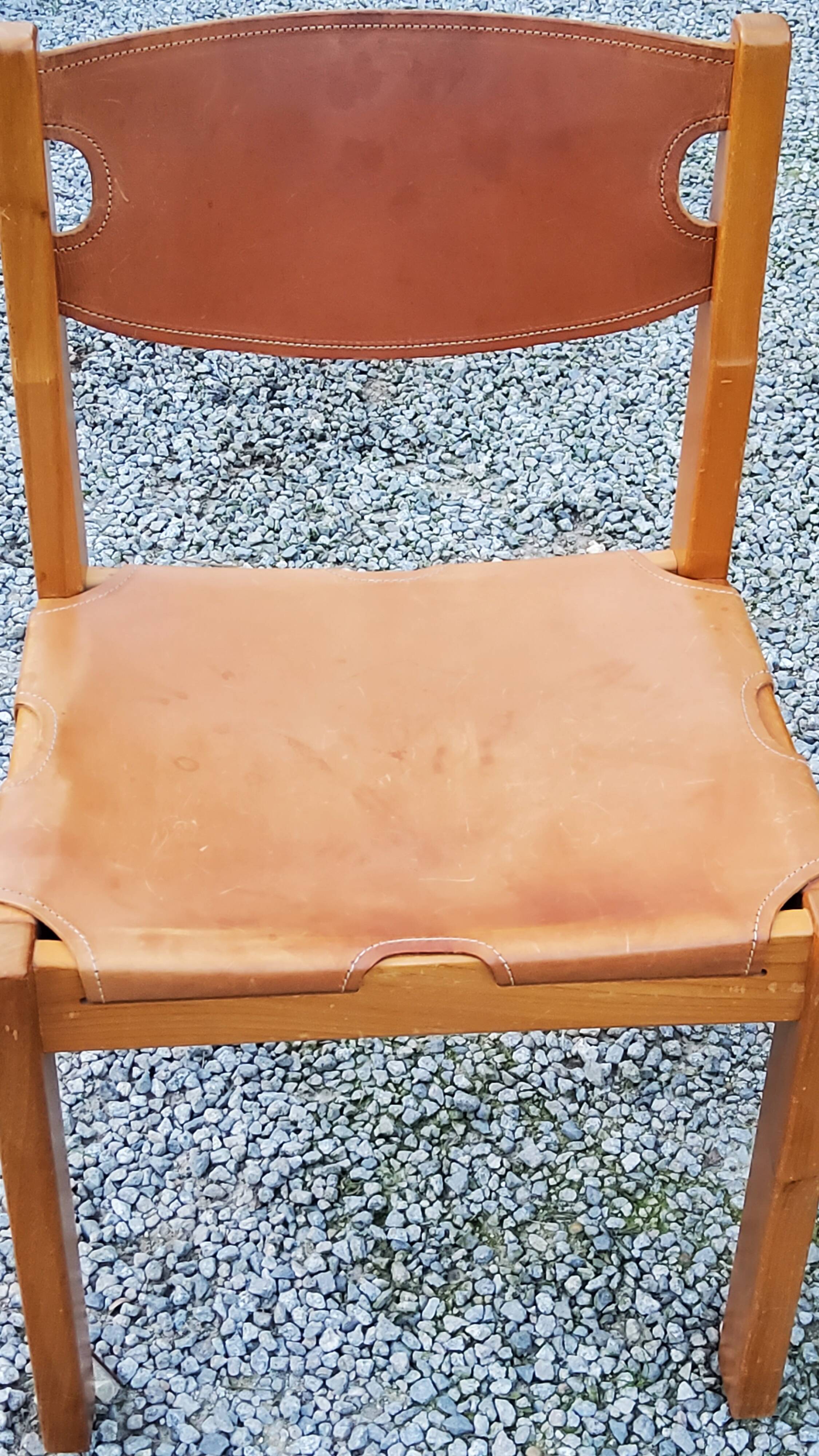 Pair of brutalist chairs in elm and stretched leather with saddle stitching Self publisher