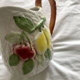 Antique barbotine pitcher with fruit decoration