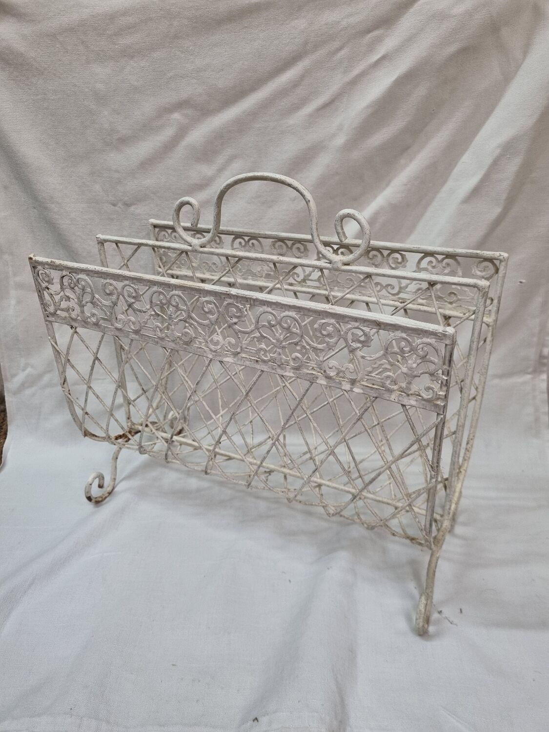 White wrought iron magazine holder