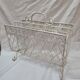 White wrought iron magazine holder