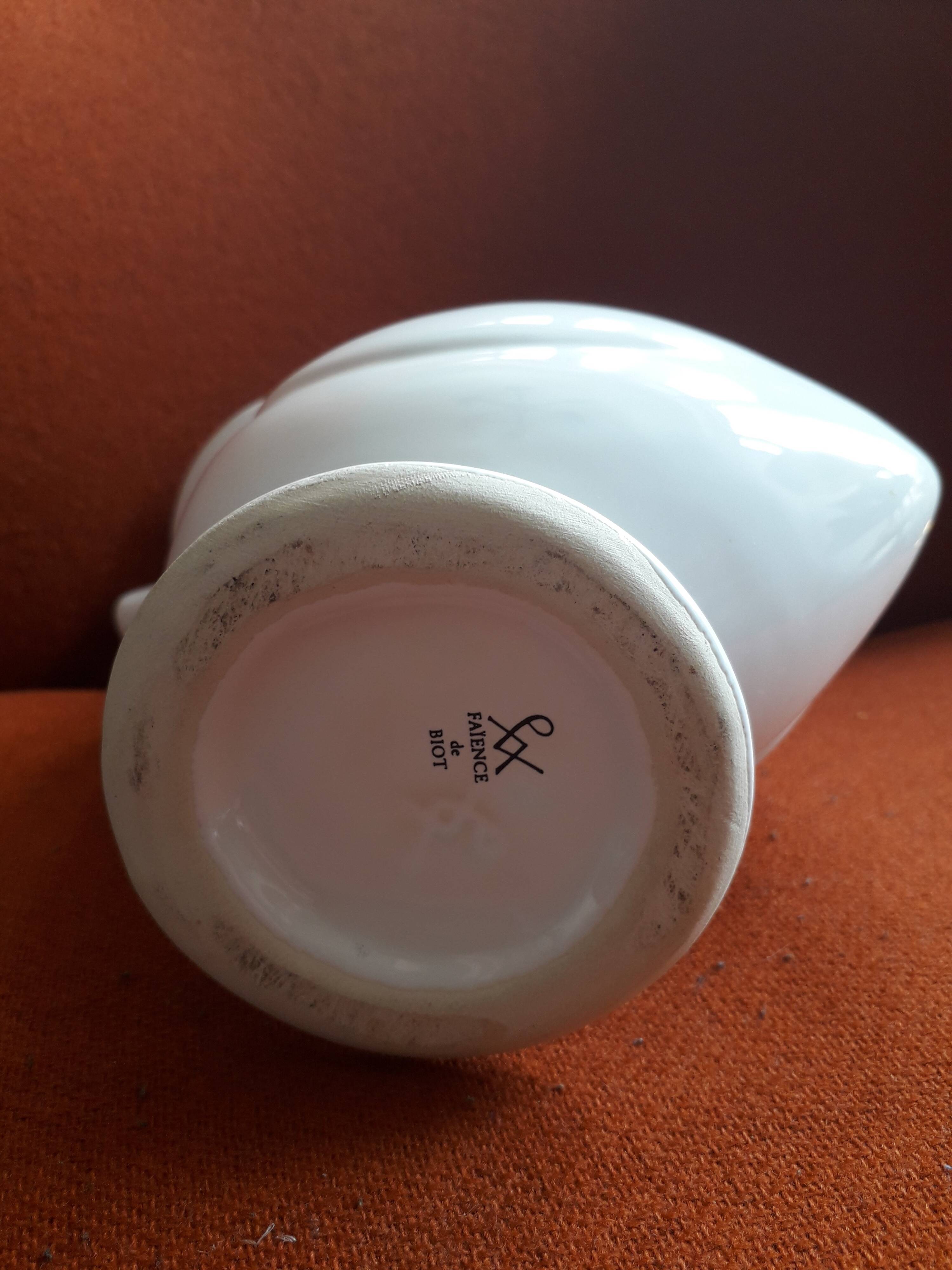 Zoomorphic vase in the shape of a bird made of Biot ceramic.