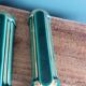 Poët Laval knife rest in emerald green ceramic and gold.