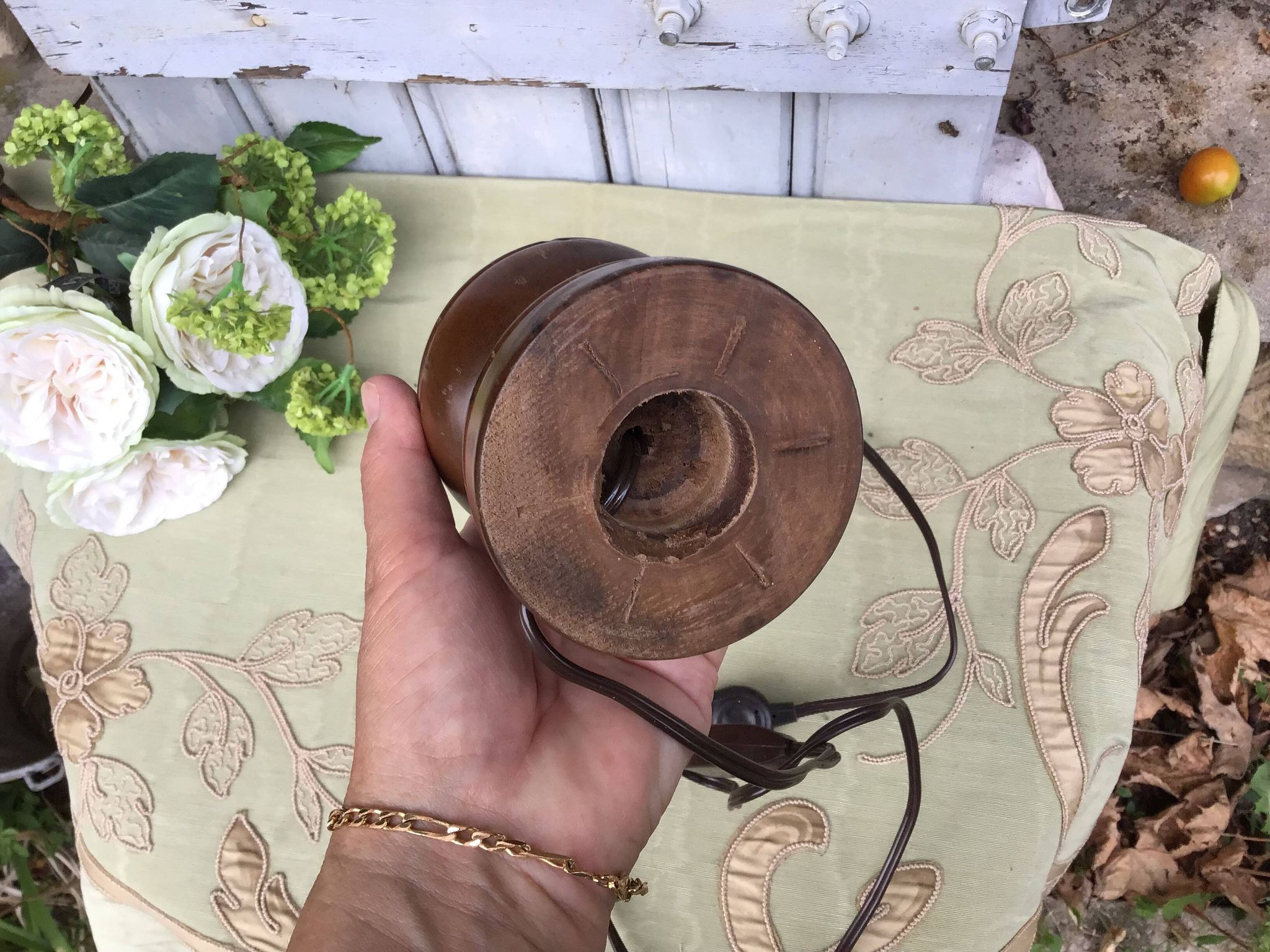 Turned wooden foot lamp with pleated lampshade
