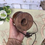 Turned wooden foot lamp with pleated lampshade