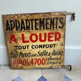 Old plaque “Apartments for rent”