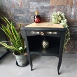 Black bedside table and raw wood