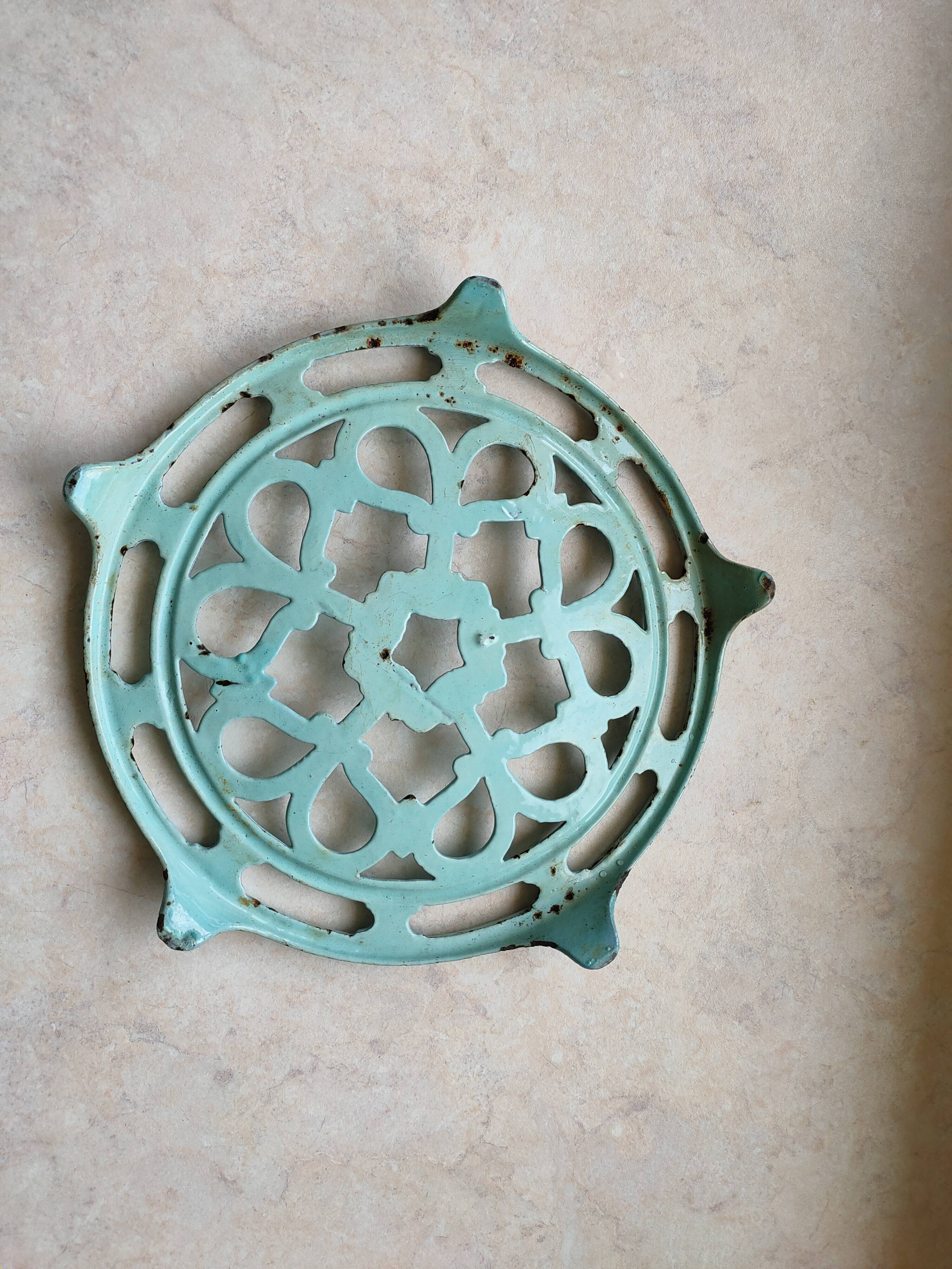 Water green enamelled trivet.