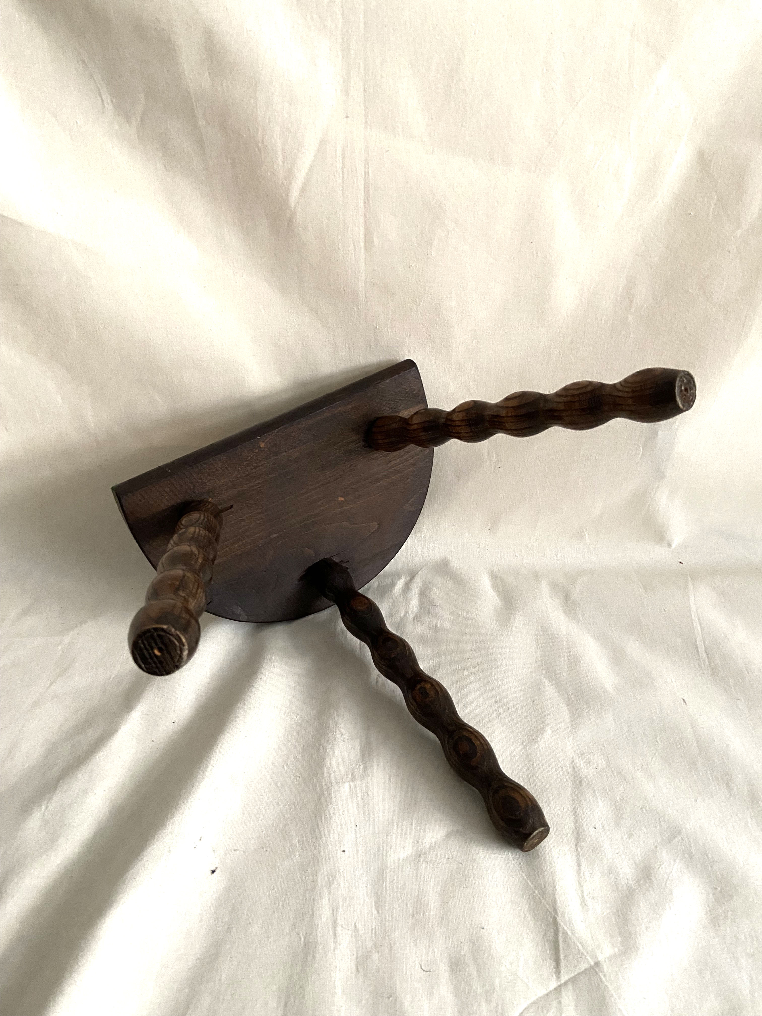 Tripod stool in turned wood