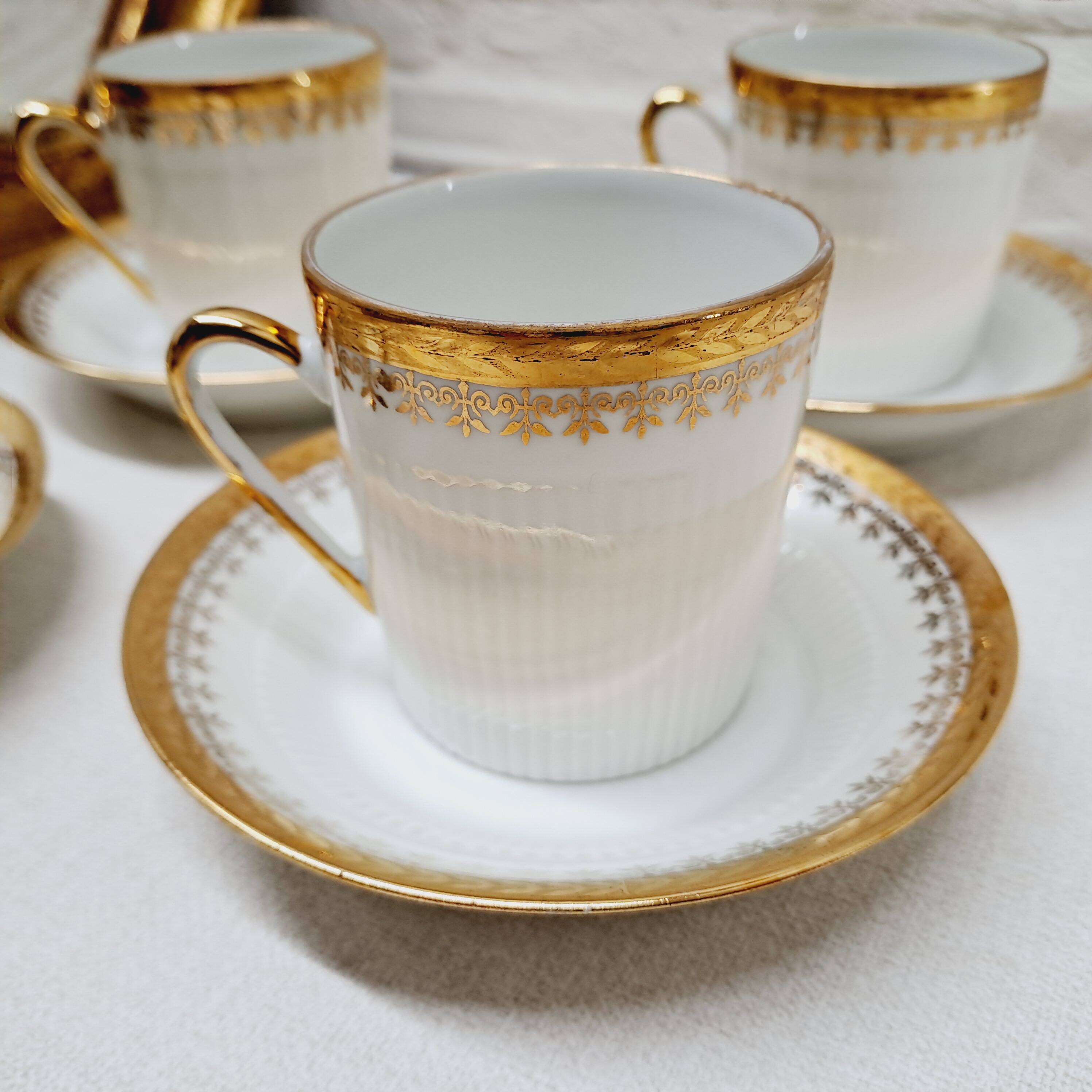 White and gold porcelain coffee maker and cups