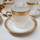 White and gold porcelain coffee maker and cups