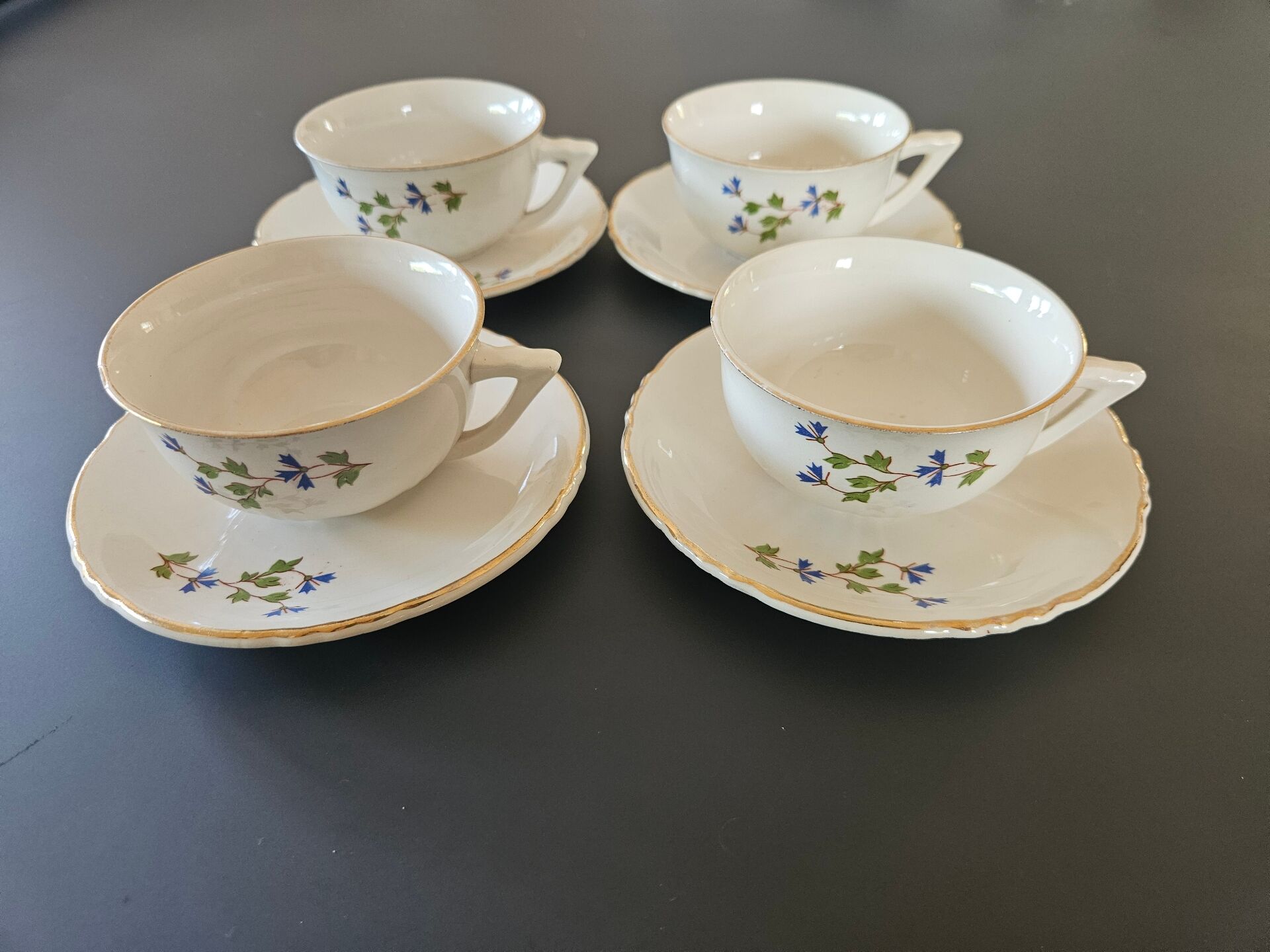charming set of 4 cups and their 4 matching saucers in earthenware