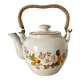 Vintage porcelain and rattan teapot