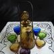 Old Italian alcohol decanter and its colorful glasses