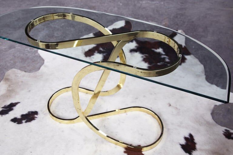 Brass ribbon console table Design Institute of America