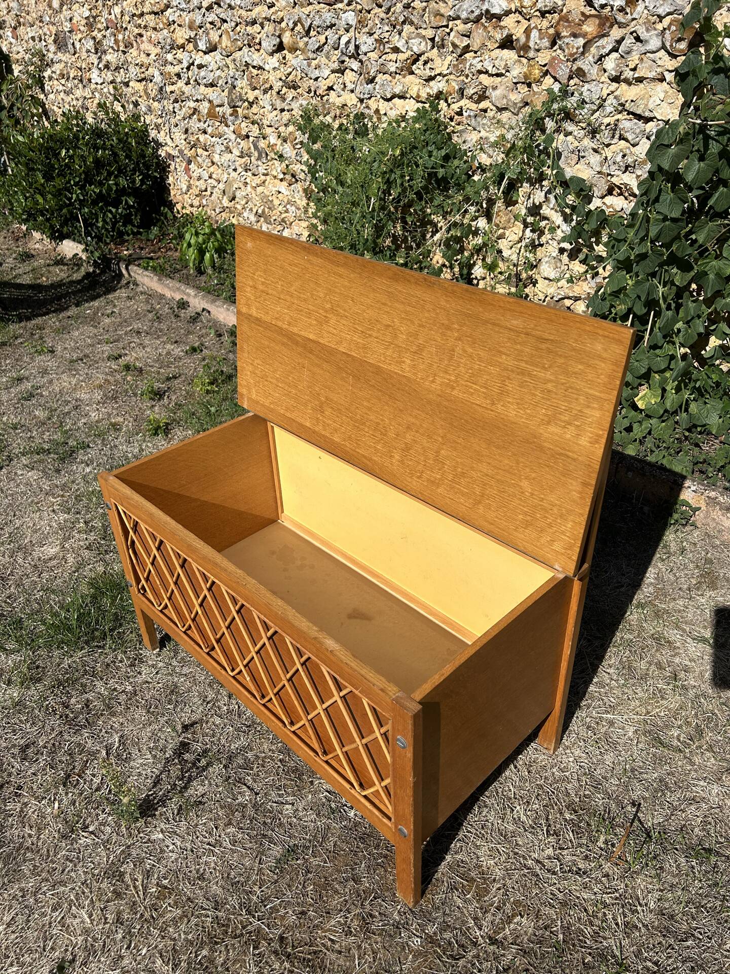 Vintage 1960s bank chest in light oak and rattan weaving.