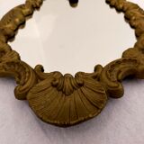 Gilded bronze mirror with angels and scrolls