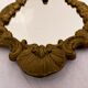Gilded bronze mirror with angels and scrolls