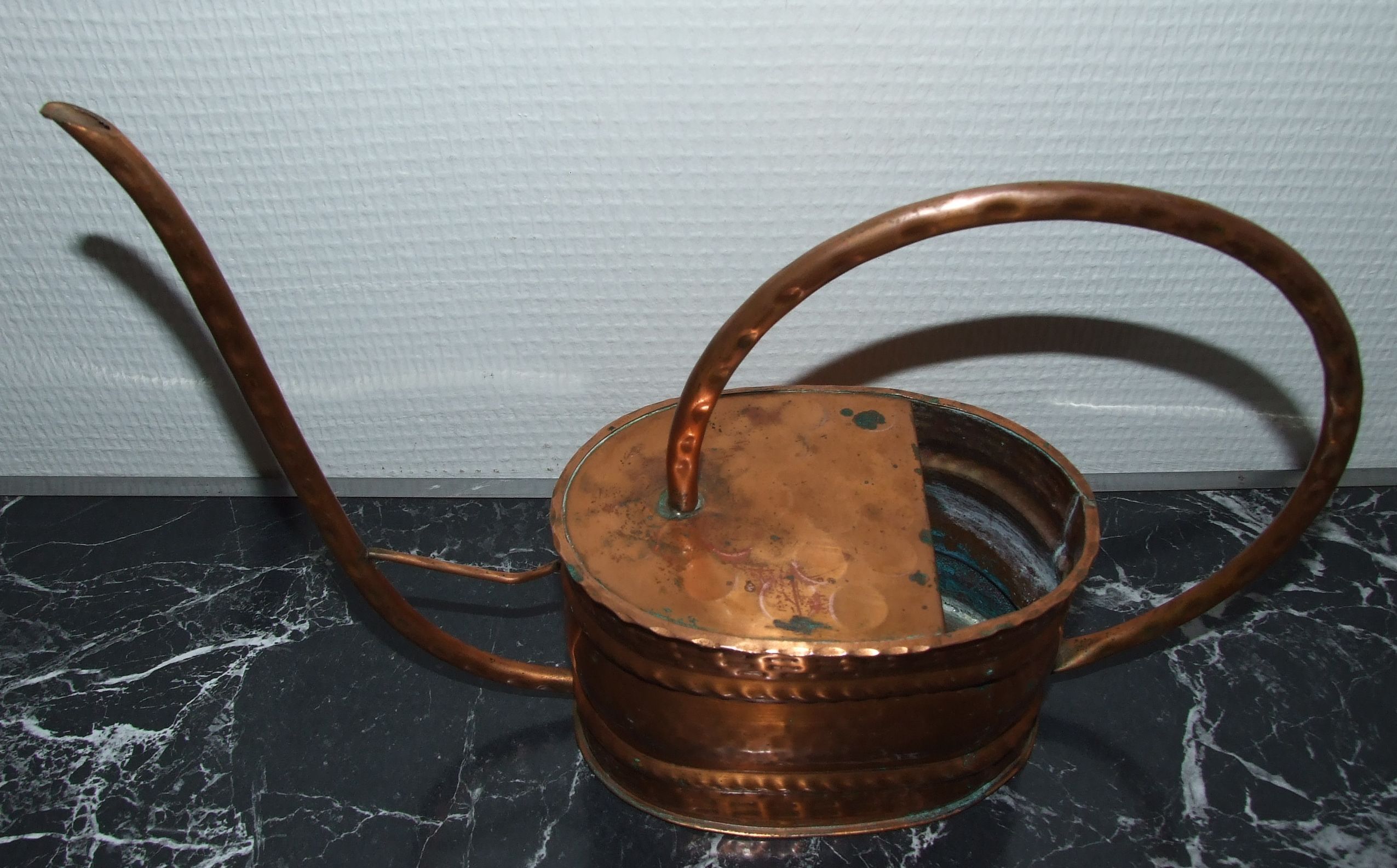 Old copper watering can