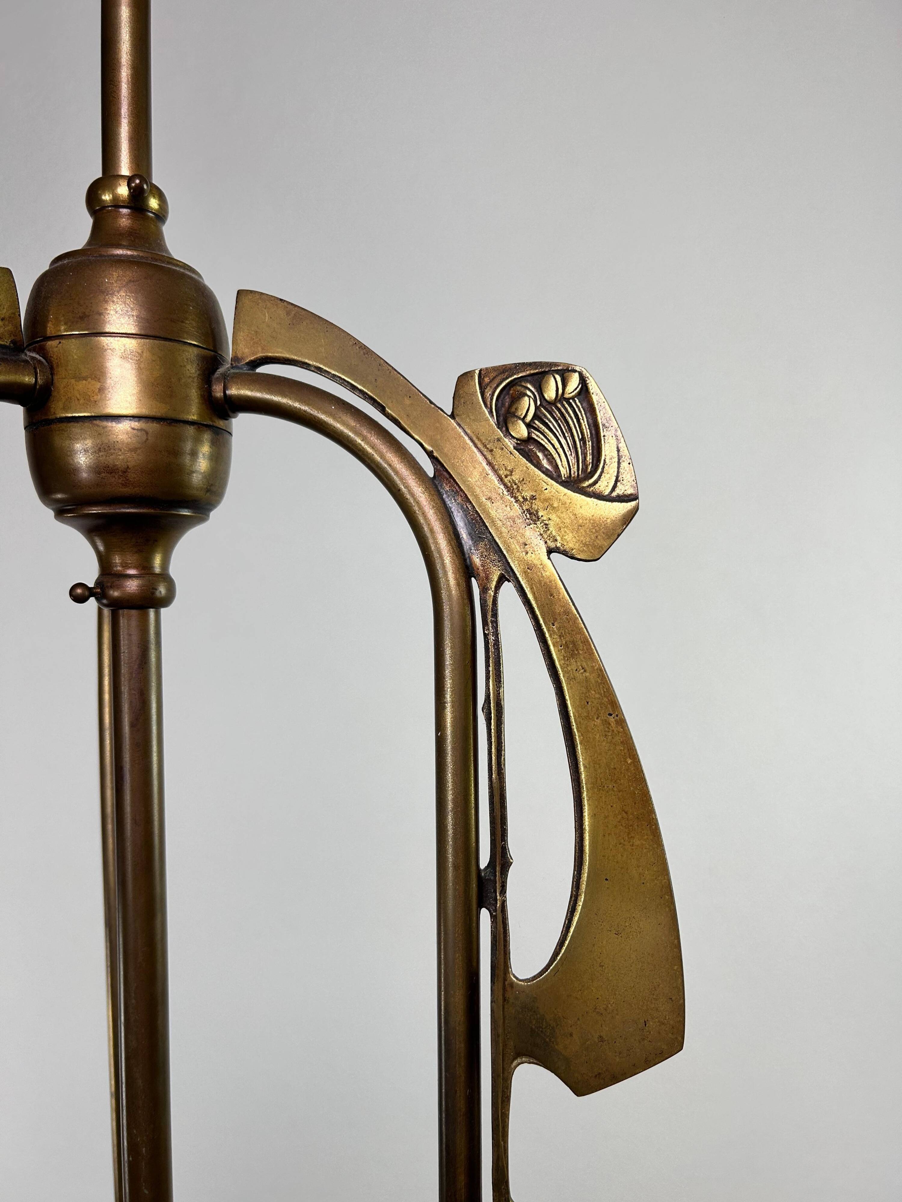 Art Nouveau chandelier with three arms and opalescent iridescent glass.
