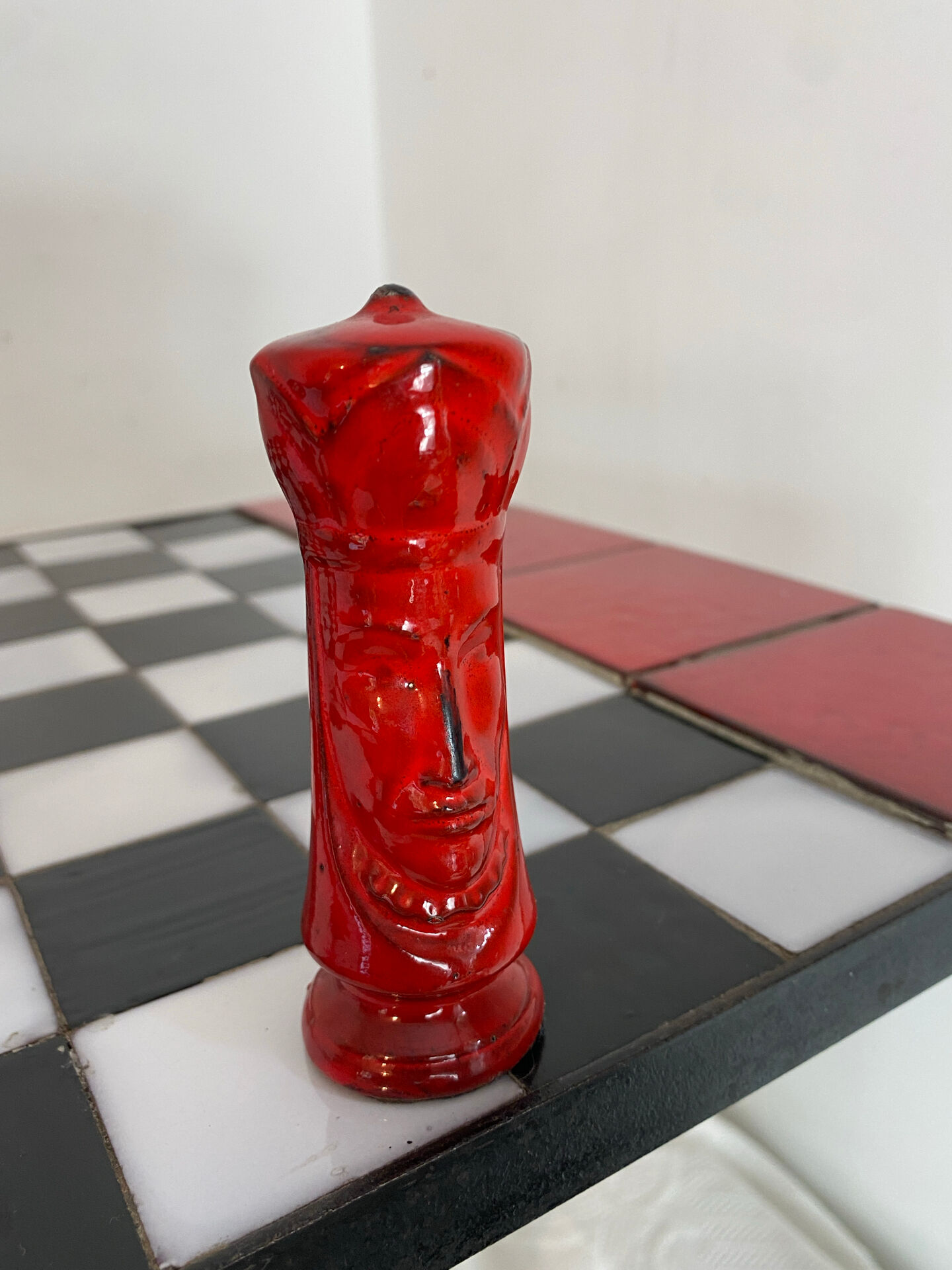 Chess set with ceramic board and pieces.