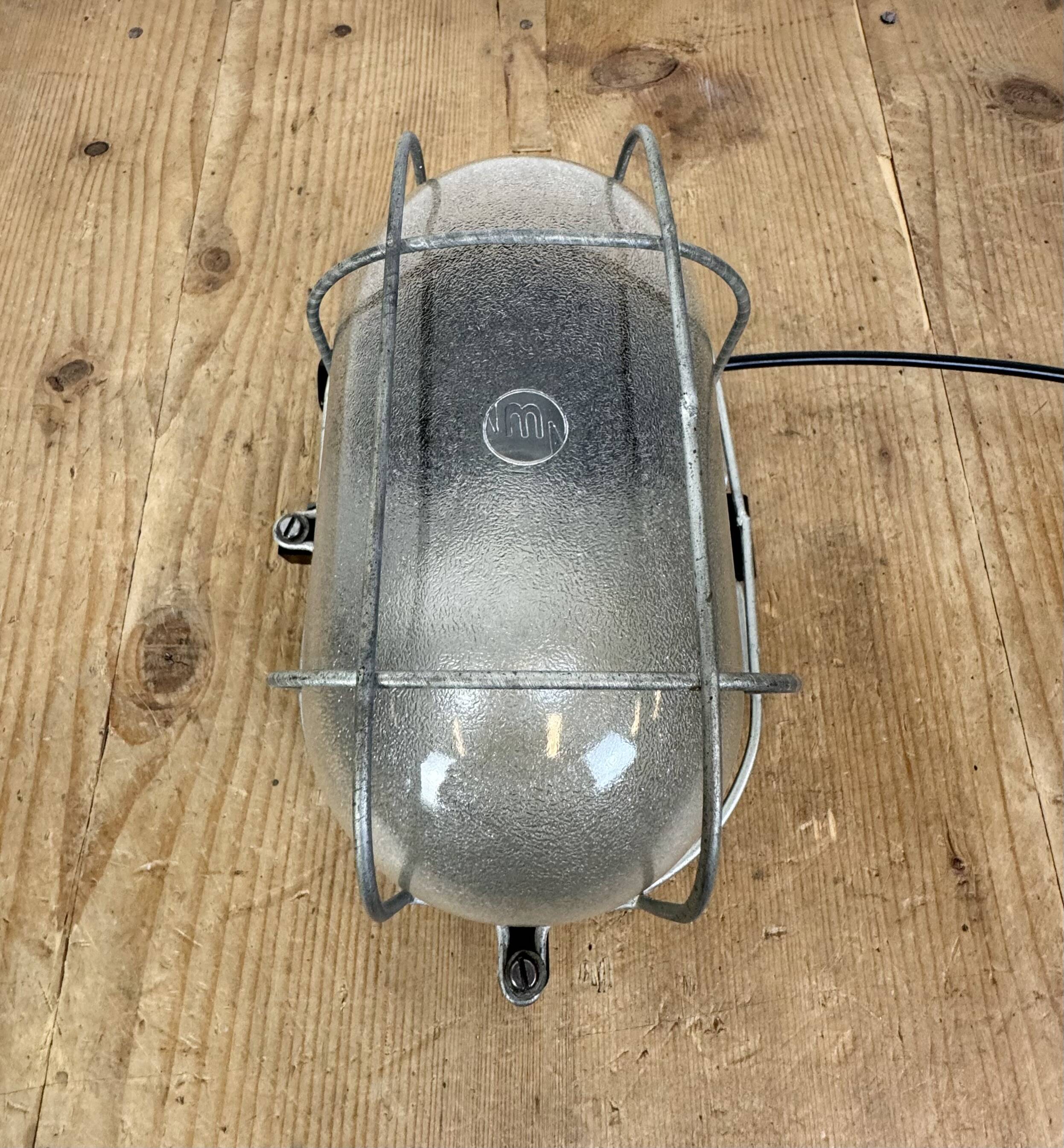 Industrial brown bakelite wall light with frosted glass, 1960s