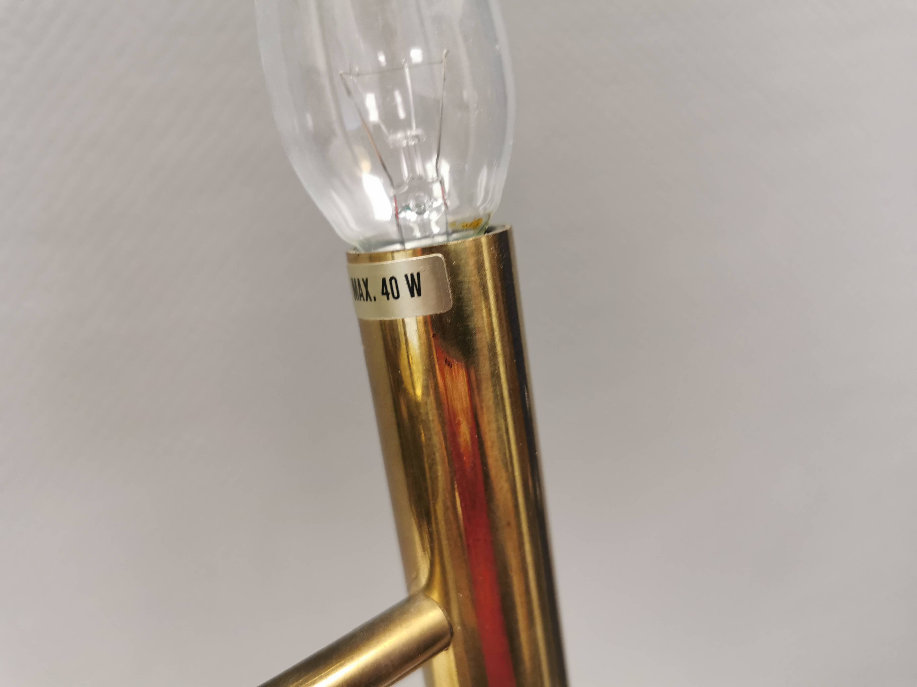 Chandelier with 3 light sources, made of metal and brass. 1960-70s