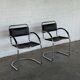 Vintage cantilever chairs in black saddle leather and chrome.