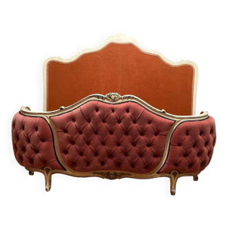 Upholstered bed in rosewood fabric