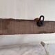 Wall-mounted coat rack with 8 turned wooden hooks in faux bamboo style.