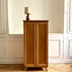 Small oak cabinet with tapered legs.