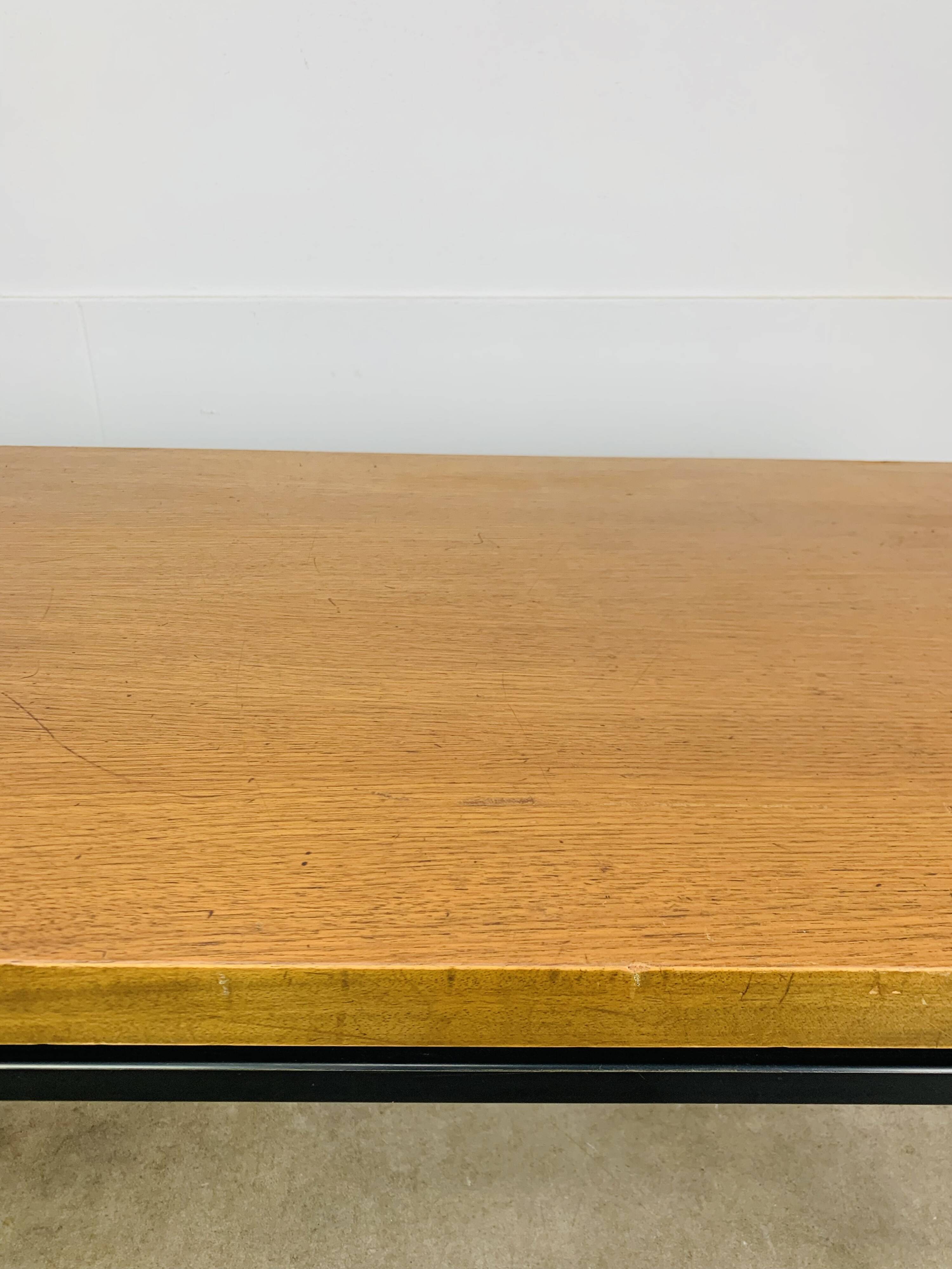 1950s modernist coffee table, wood and black metal.