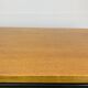 1950s modernist coffee table, wood and black metal.