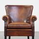 Sheepskin armchair/lounge chair finished with decorative nailheads