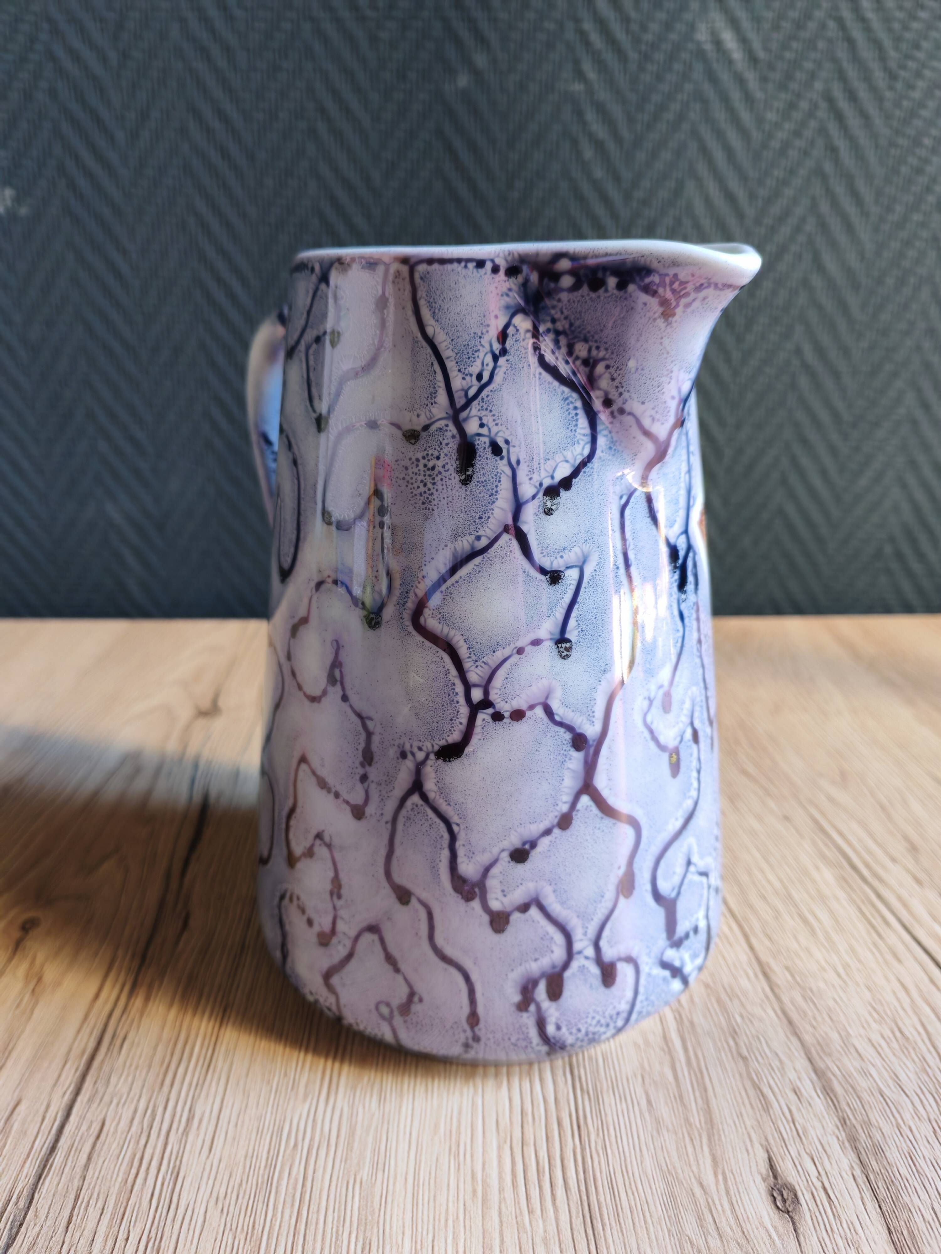Vintage porcelain pitcher Lusseray France, decorated with grape clusters.