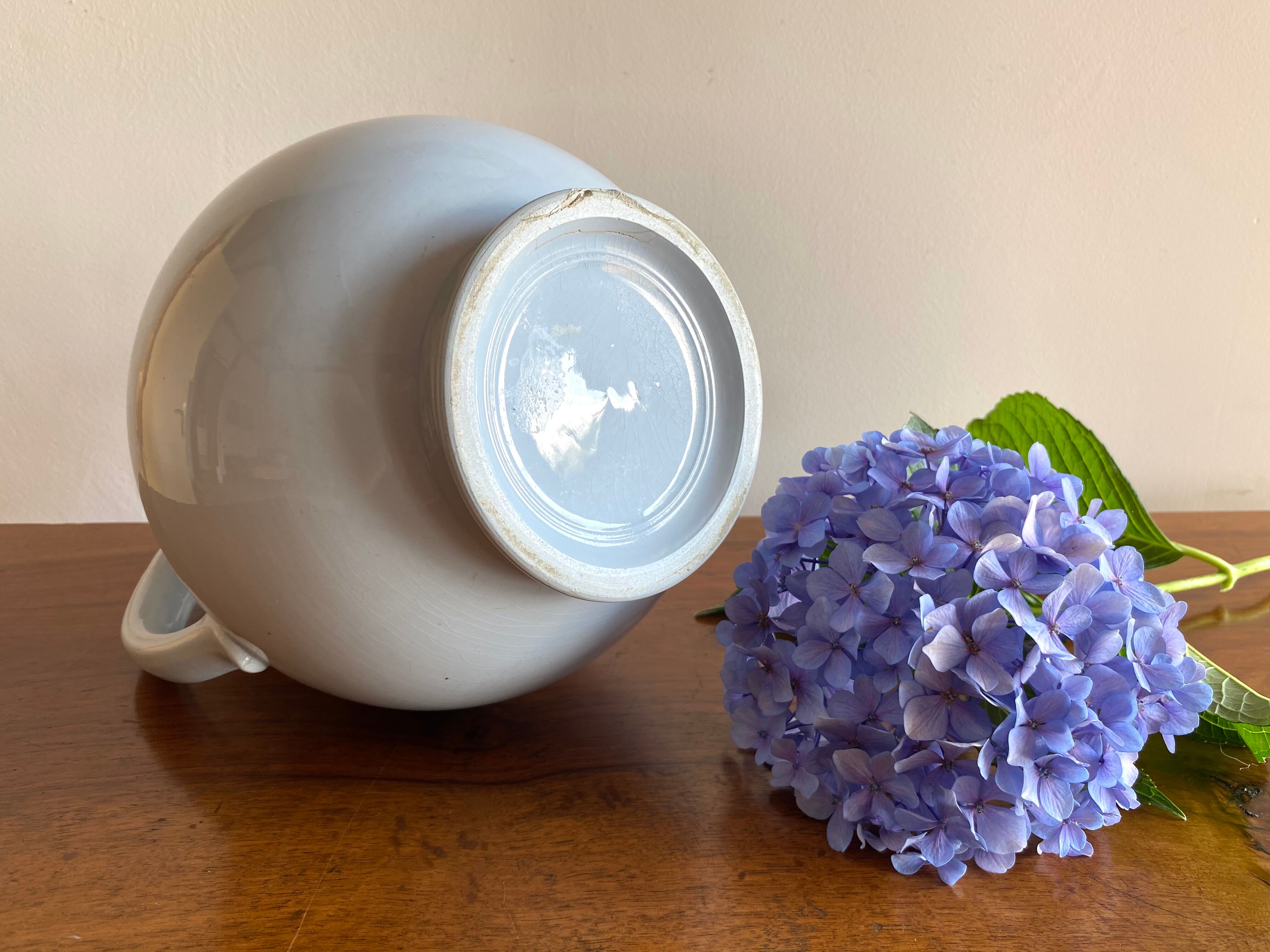 Antique vase in pale blue ceramic