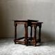 Pair of antique nesting tables made of turned wood.