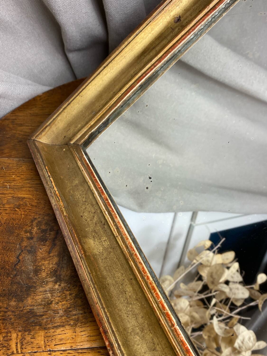 Antique mirror in gilded wood