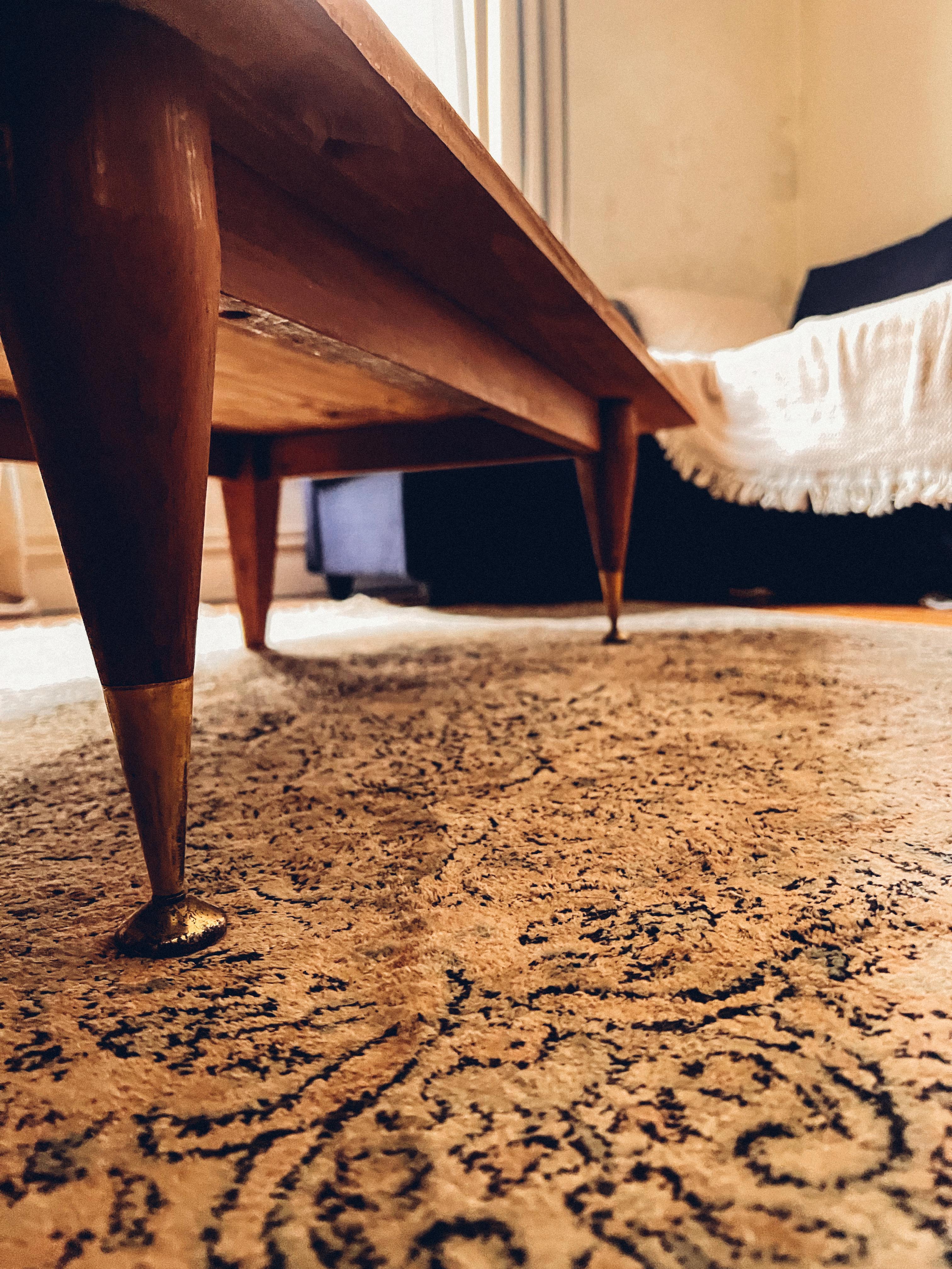 Coffee table in wood and brass