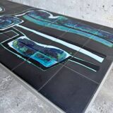Mid-century Denisco ceramic coffee table — black, blue and white glazed tile top with silver metal base