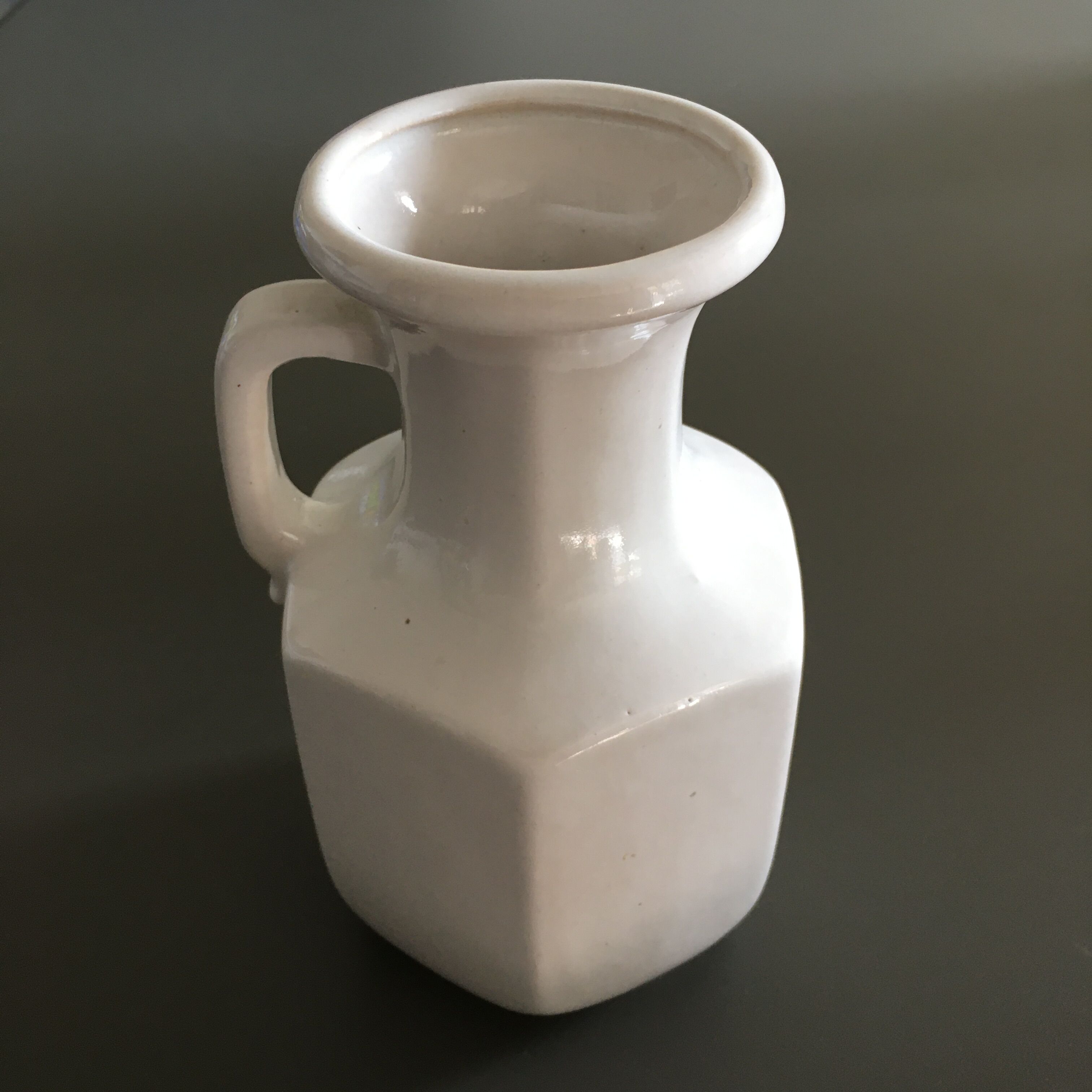 Ivory vase with handle