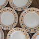 10 dessert plates Saint Amand Amandinoise frilled with orange and black flowers.