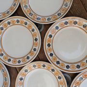 10 dessert plates Saint Amand Amandinoise frilled with orange and black flowers.