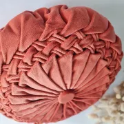 Pleated terracotta red velvet cushion