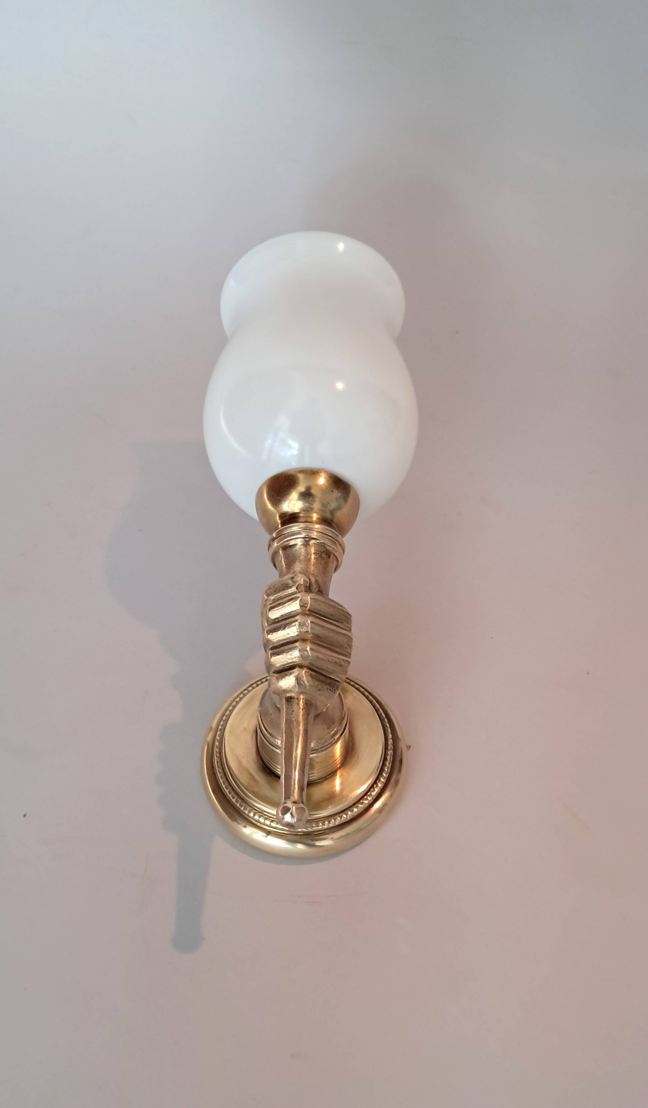 Golden brass wall light from the 1950s.