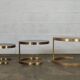 Superb trundle table round golden and smoked glass